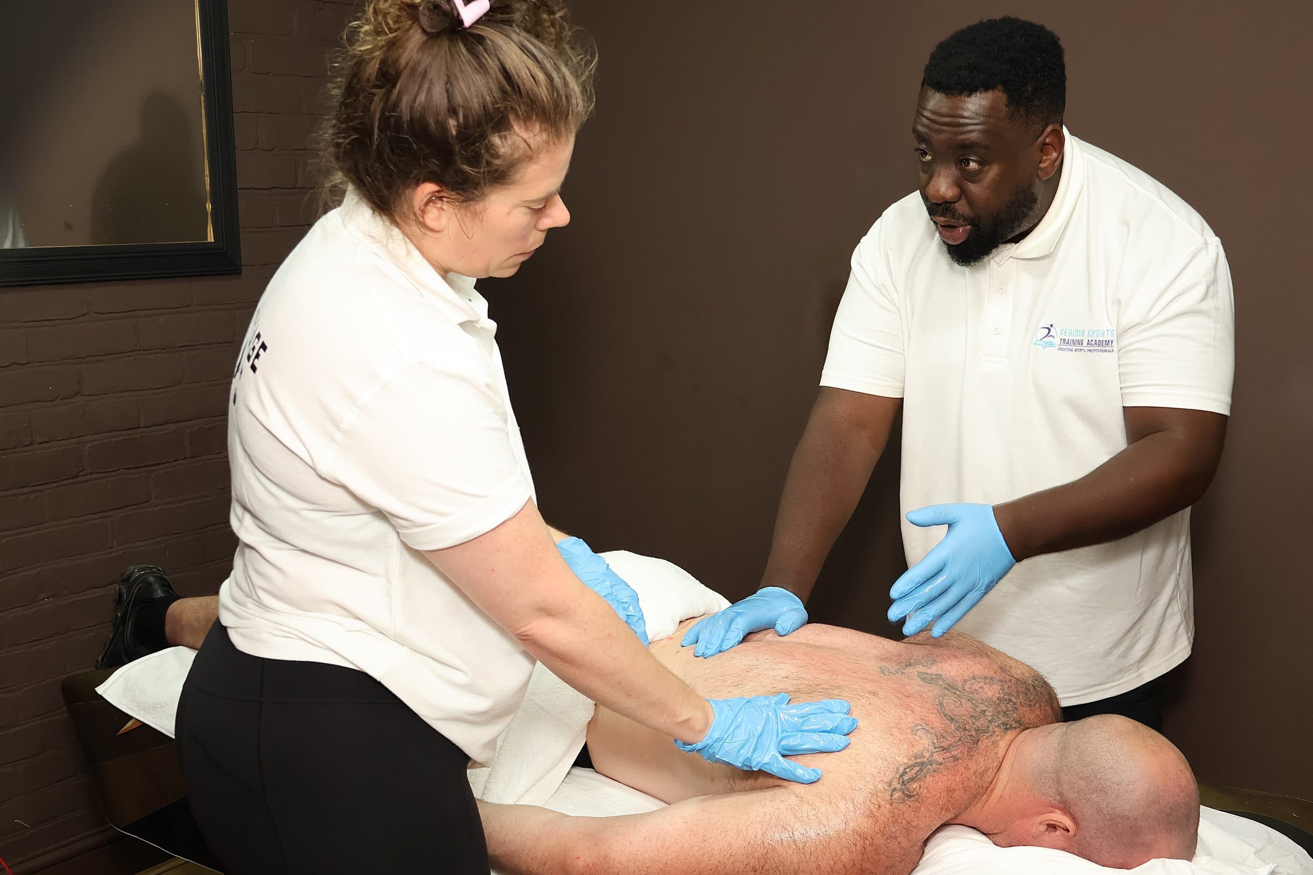 Hands-on sports massage practice at Serious Sports Training Academy